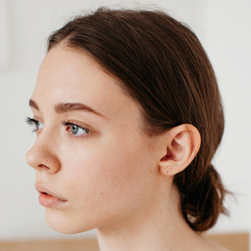 Girl showing her ear