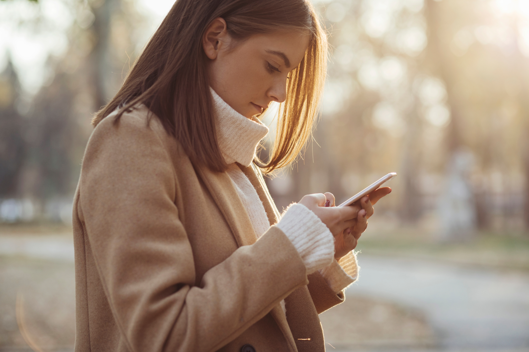 Young woman using her cell phone